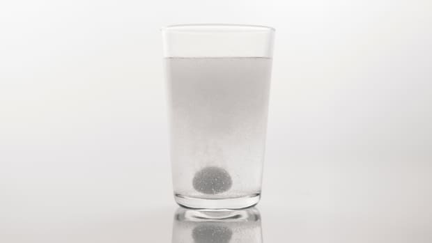 a medicine dissolved in a glass of water