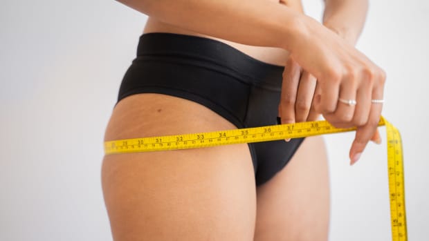 Woman measuring hips